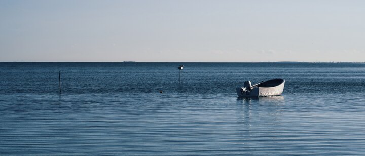 Wide panorama of the Hagensche Wiek bay on Rügen in evening light.