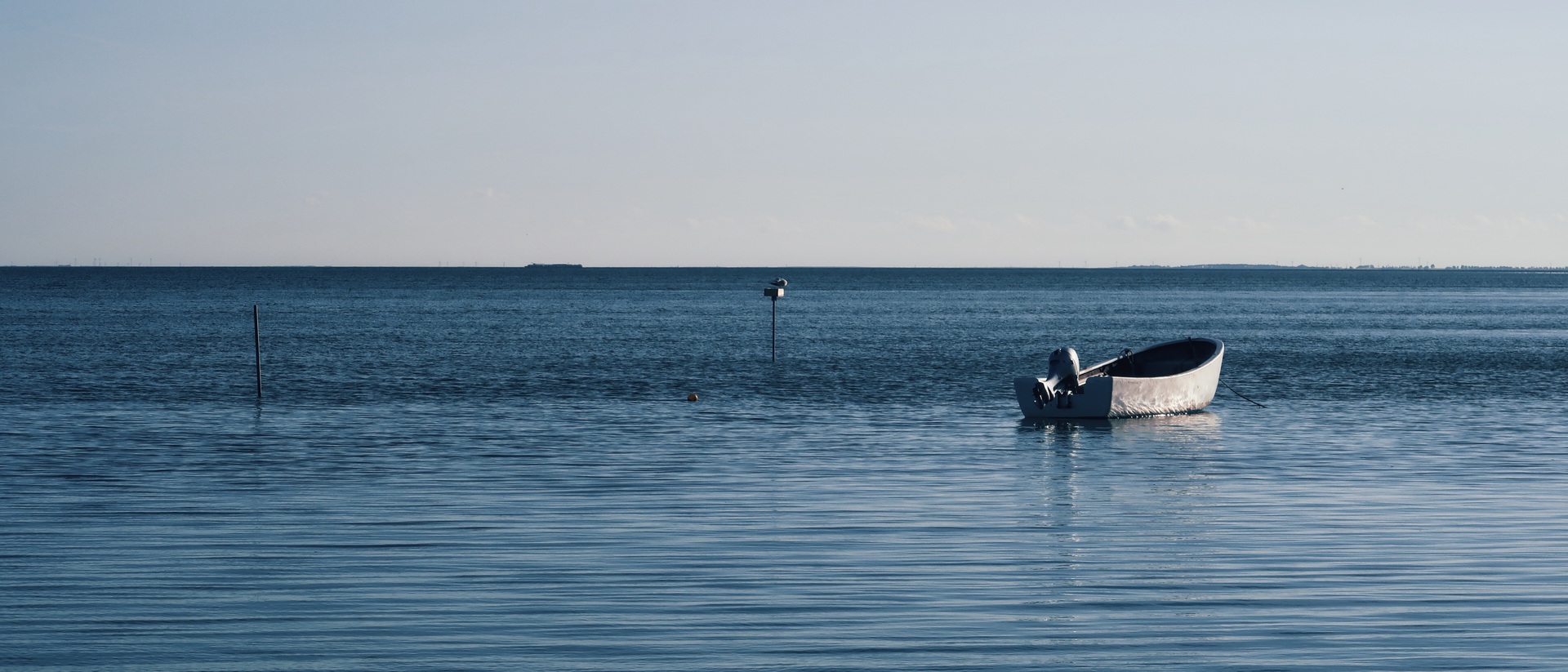 Wide panorama of the Hagensche Wiek bay on Rügen in evening light.